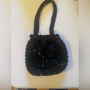 Black beaded hand purse.